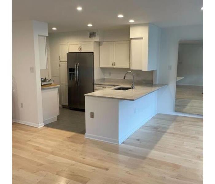 Rennovaded apartment kitchen after damage remediation. 